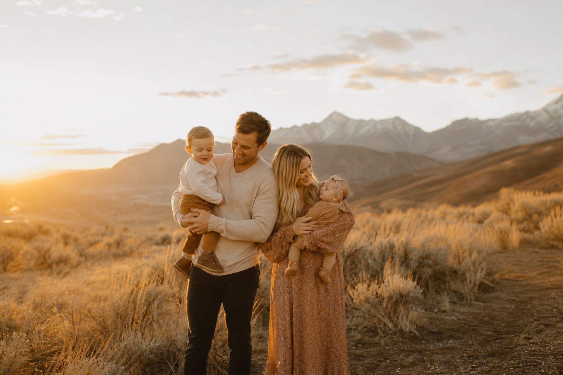 A family during a golden-hour portrait session in the Utah mountains